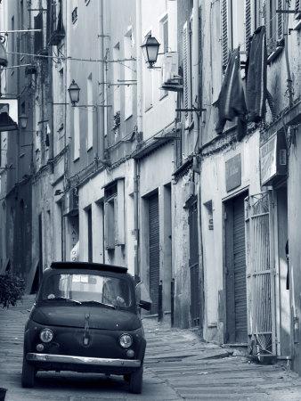https://imgc.allpostersimages.com/img/posters/fiat-driving-in-narrow-street-sassari-sardinia-italy_u-L-P38IRO0.jpg?artPerspective=n