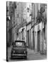 Fiat Driving in Narrow Street, Sassari, Sardinia, Italy-Doug Pearson-Stretched Canvas