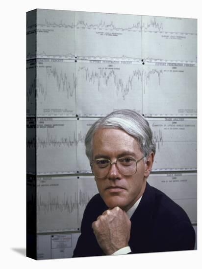 Fidelity Magellan Fund Manager Peter Lynch in Front of Graph of American Stock Prices-null-Stretched Canvas