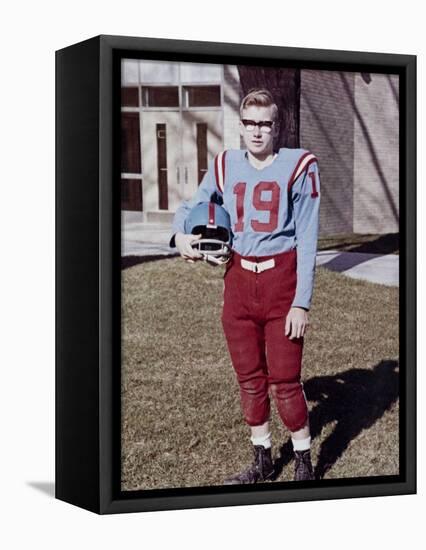 Fifteen year old high school football player portrait outside the school, ca. 1961-null-Framed Stretched Canvas