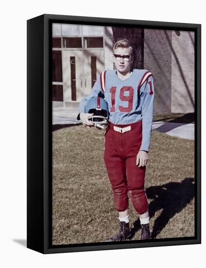 Fifteen year old high school football player portrait outside the school, ca. 1961-null-Framed Stretched Canvas