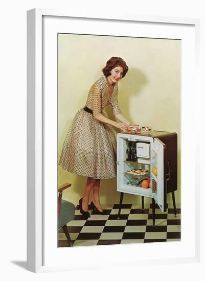 Fifties Housewife with Mini-Fridge-null-Framed Art Print