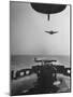 Fighter Plane Coming in for a Landing onto Flight Deck of a US Navy Carrier-null-Mounted Photographic Print