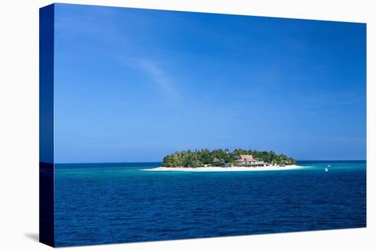 Fiji. Boats head towards Beachcomber Island, in the Mamanuca Island chain.-Micah Wright-Stretched Canvas