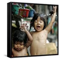 Filipino Children React as They Get a Shower Outside Their Homes-null-Framed Stretched Canvas