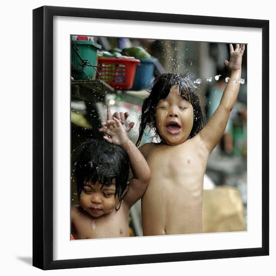 Filipino Children React as They Get a Shower Outside Their Homes-null-Framed Premium Photographic Print