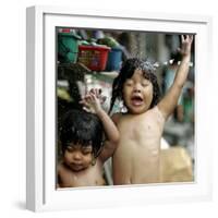 Filipino Children React as They Get a Shower Outside Their Homes-null-Framed Photographic Print