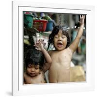 Filipino Children React as They Get a Shower Outside Their Homes-null-Framed Photographic Print