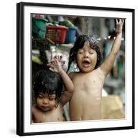 Filipino Children React as They Get a Shower Outside Their Homes-null-Framed Photographic Print