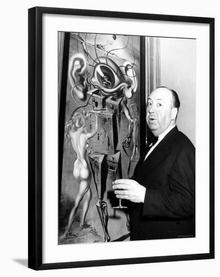 Film Director Alfred Hitchcock, Standing Beside Salvador Dali's Painting "Movies"-Herbert Gehr-Framed Premium Photographic Print