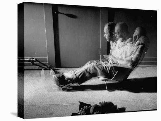 Film Director Billy Wilder Sitting in Chair Designed by Charles Eames Made of Plastic-Peter Stackpole-Stretched Canvas