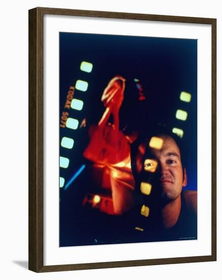 Film Director Quentin Tarantino Framed by Projected Clip From His Movie "Pulp Fiction"-Ted Thai-Framed Premium Photographic Print