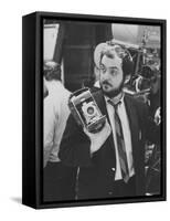 Film Director Stanley Kubrick Holding Polaroid Camera During Filming of "2001: A Space Odyssey"-Dmitri Kessel-Framed Stretched Canvas