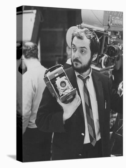 Film Director Stanley Kubrick Holding Polaroid Camera During Filming of "2001: A Space Odyssey"-Dmitri Kessel-Stretched Canvas