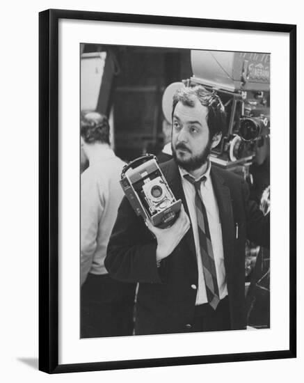 Film Director Stanley Kubrick Holding Polaroid Camera During Filming of "2001: A Space Odyssey"-Dmitri Kessel-Framed Premium Photographic Print