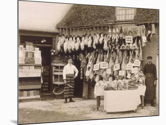 Fine Display of Meat Displayed Outside a Butcher's Shop-null-Mounted Photographic Print