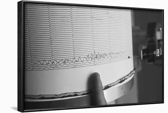 Finger Pointing to Earthquake Reading on Seismograph-null-Framed Photographic Print