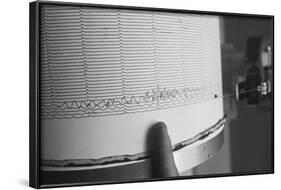 Finger Pointing to Earthquake Reading on Seismograph-null-Framed Photographic Print