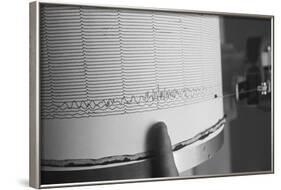 Finger Pointing to Earthquake Reading on Seismograph-null-Framed Photographic Print