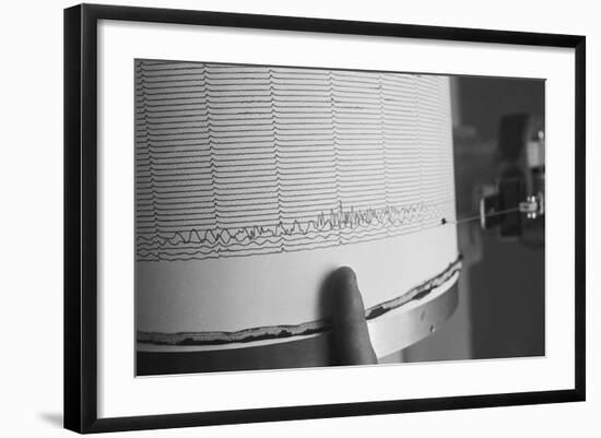 Finger Pointing to Earthquake Reading on Seismograph-null-Framed Photographic Print