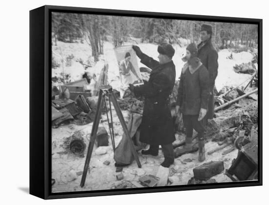 Finnish Soldiers Looking at a Patriotic Poster Left Behind by Defeated Russian Troops-Carl Mydans-Framed Stretched Canvas