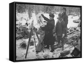 Finnish Soldiers Looking at a Patriotic Poster Left Behind by Defeated Russian Troops-Carl Mydans-Framed Stretched Canvas