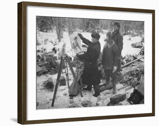 Finnish Soldiers Looking at a Patriotic Poster Left Behind by Defeated Russian Troops-Carl Mydans-Framed Premium Photographic Print