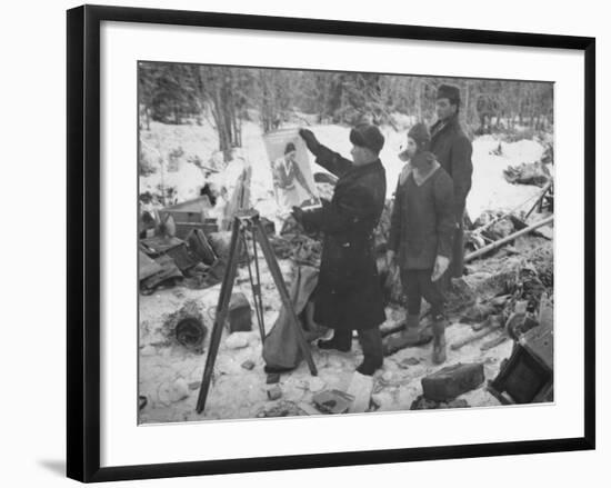 Finnish Soldiers Looking at a Patriotic Poster Left Behind by Defeated Russian Troops-Carl Mydans-Framed Premium Photographic Print