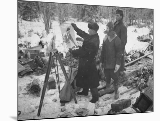 Finnish Soldiers Looking at a Patriotic Poster Left Behind by Defeated Russian Troops-Carl Mydans-Mounted Premium Photographic Print