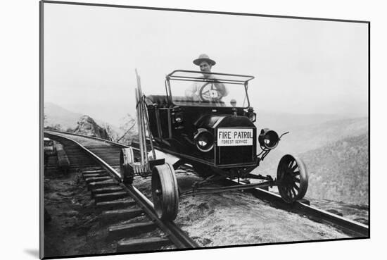 Fire Patrol Rides Steel Wheeled Car over Railroad Tracks-null-Mounted Art Print