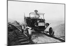 Fire Patrol Rides Steel Wheeled Car over Railroad Tracks-null-Mounted Art Print