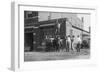 Firefighter Jumps Into Net Held By Fellow Firemen-null-Framed Art Print