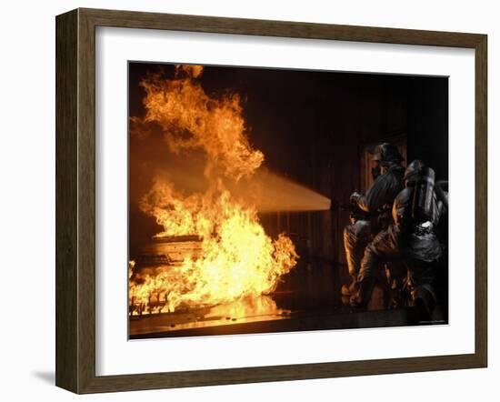 Firefighters Extinguishing a Simulated Battery Fire-Stocktrek Images-Framed Photographic Print