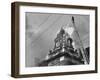 Fireman on Ladder Using a Hose to Extinguish Blazing Building Set Afire-Hans Wild-Framed Photographic Print