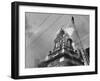 Fireman on Ladder Using a Hose to Extinguish Blazing Building Set Afire-Hans Wild-Framed Photographic Print