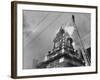 Fireman on Ladder Using a Hose to Extinguish Blazing Building Set Afire-Hans Wild-Framed Photographic Print