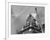 Fireman on Ladder Using a Hose to Extinguish Blazing Building Set Afire-Hans Wild-Framed Photographic Print