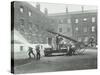 Fireman Using a Hose, London Fire Brigade Headquarters, London, 1910-null-Stretched Canvas