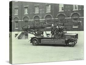 Firemen Aboard a Fire Engine, London Fire Brigade Headquarters, London, 1929-null-Stretched Canvas