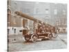 Firemen Aboard a Motor Fire Escape Vehicle, London Fire Brigade Headquarters, London, 1909-null-Stretched Canvas