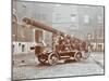 Firemen Aboard a Motor Fire Escape Vehicle, London Fire Brigade Headquarters, London, 1909-null-Mounted Premium Photographic Print