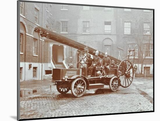 Firemen Aboard a Motor Fire Escape Vehicle, London Fire Brigade Headquarters, London, 1909-null-Mounted Photographic Print