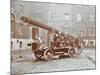 Firemen Aboard a Motor Fire Escape Vehicle, London Fire Brigade Headquarters, London, 1909-null-Mounted Photographic Print