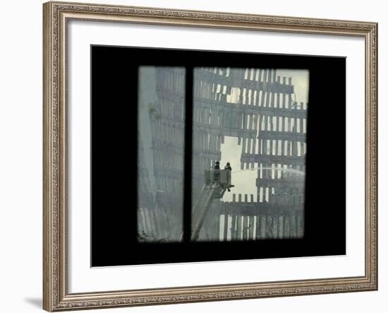 Firemen are Seen Spraying Water on the Smoldering Ruins of the World Trade Center-null-Framed Photographic Print