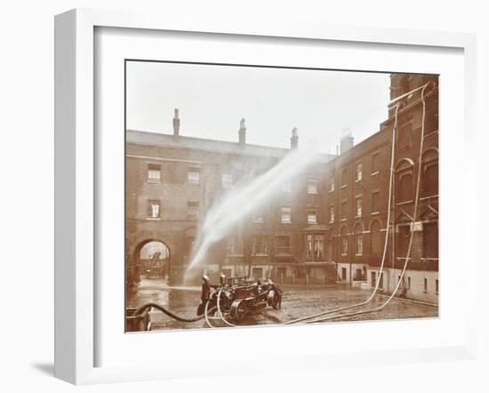 Firemen Demonstrating Hoses Worked by a Petrol Motor Pump, London Fire Brigade Headquarters, 1909-null-Framed Photographic Print