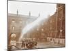 Firemen Demonstrating Hoses Worked by a Petrol Motor Pump, London Fire Brigade Headquarters, 1909-null-Mounted Photographic Print