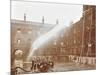 Firemen Demonstrating Hoses Worked by a Petrol Motor Pump, London Fire Brigade Headquarters, 1909-null-Mounted Photographic Print