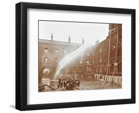 Firemen Demonstrating Hoses Worked by a Petrol Motor Pump, London Fire Brigade Headquarters, 1909-null-Framed Photographic Print