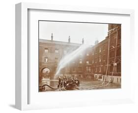 Firemen Demonstrating Hoses Worked by a Petrol Motor Pump, London Fire Brigade Headquarters, 1909-null-Framed Photographic Print