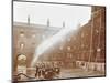 Firemen Demonstrating Hoses Worked by a Petrol Motor Pump, London Fire Brigade Headquarters, 1909-null-Mounted Photographic Print